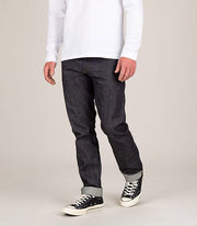 Front of man wearing mens indigo organic cotton premium 13oz Japanese selvedge denim jeans by Finisterre