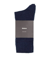 Finisterre's long, thick navy blue socks for men and women, made with sustainable wool.