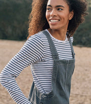 Woman wearing a classic long-sleeve stripey tee from Finisterre made from premium organic cotton
